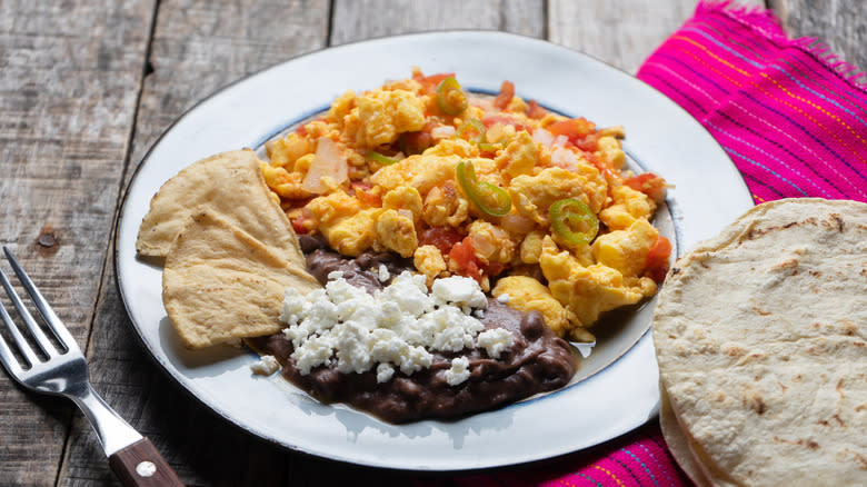 Scrambled eggs with salsa and beans