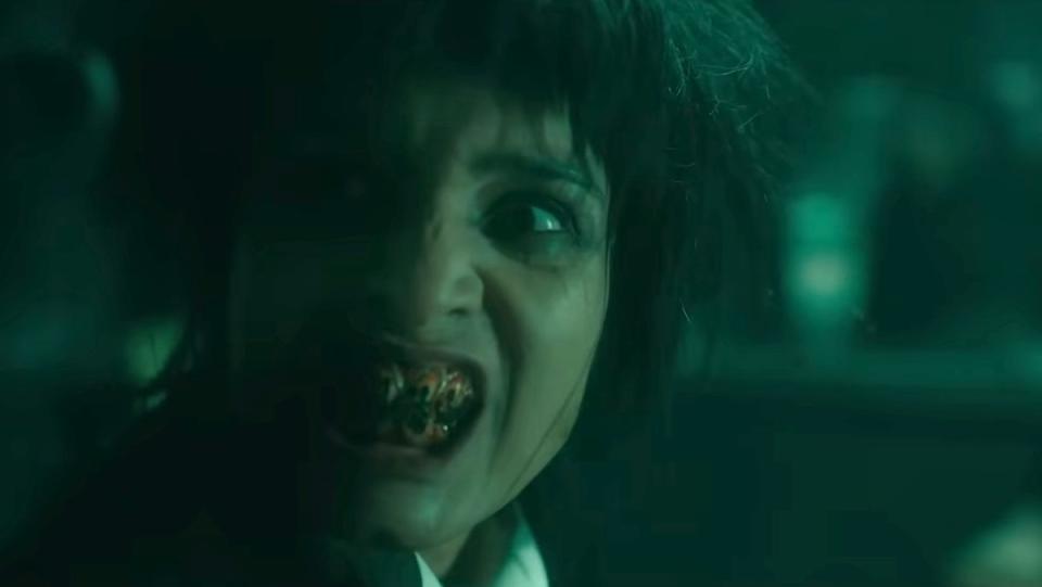 The demon Beelzebub shows her gross teeth in anger on Good Omens