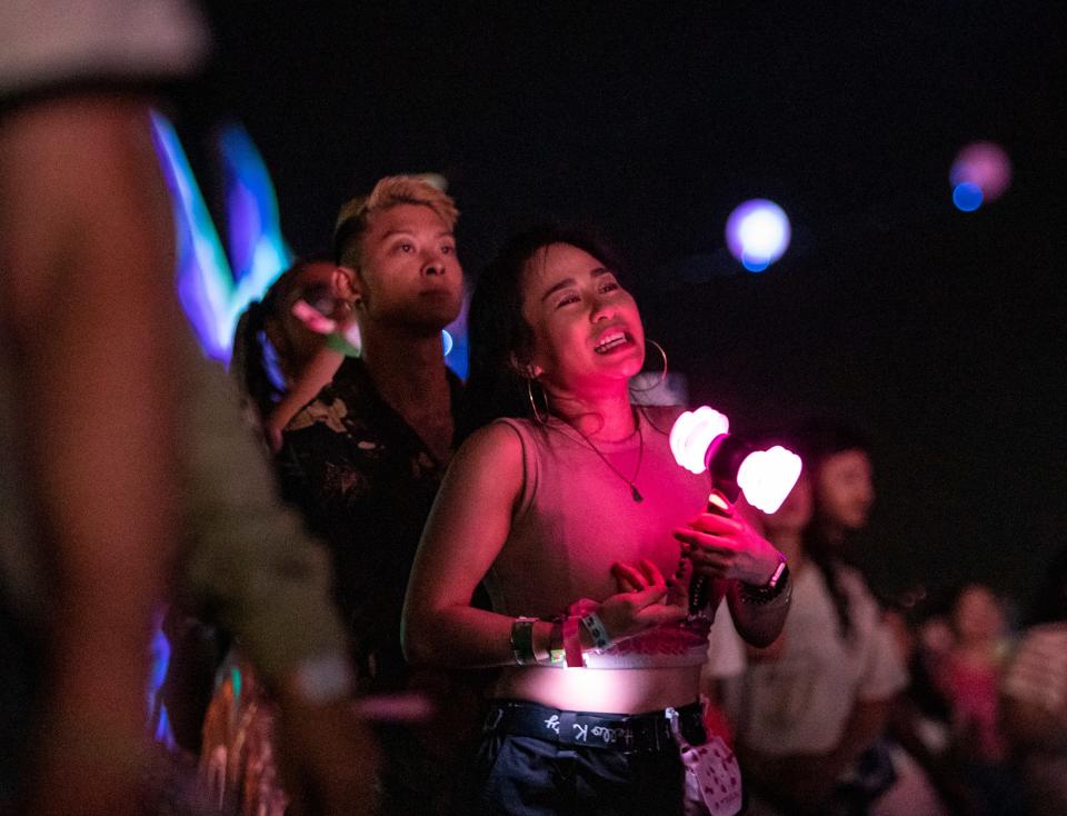 Ashleigh Tran of Los Angeles dances and sings along to BLACKPINK's headlining set on the Coachella stage during the Coachella Valley Music and Arts Festival at the Empire Polo Club in Indio, Calif., Saturday, April 22, 2023. 