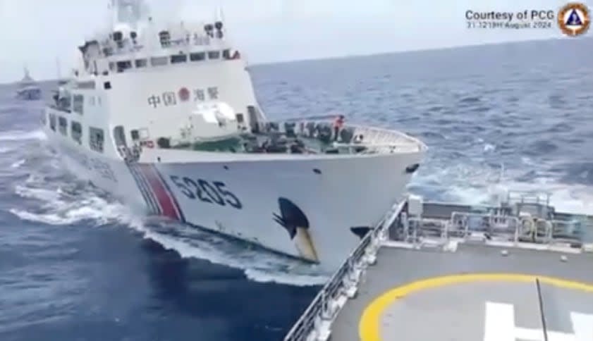 In this image taken from handout video provided by the Philippine Coast Guard, a Chinese Coast Guard ship with bow number 5205, right, collides with Philippine Coast Guard vessel BRP Teresa Magbanua near the Sabina Shoal at the disputed South China Sea on Saturday Aug. 31, 2024. (Philippine Coast Guard via AP)