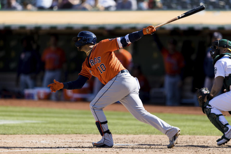 Houston Astros' Yuli Gurriel hits an RBI-double against the Oakland Athletics in the sixth inning of a baseball game in Oakland, Calif., Sunday, Sept. 26, 2021. (AP Photo/John Hefti)