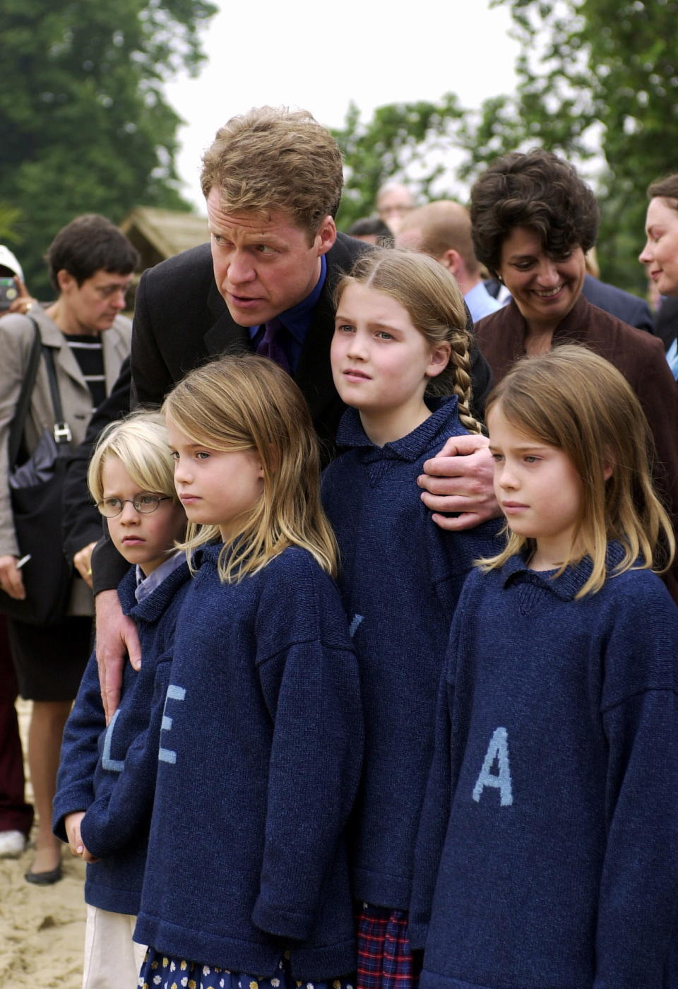 Louis, Eliza, Kitty and Amelia pose in monogrammed jumpers with their father Earl Spencer