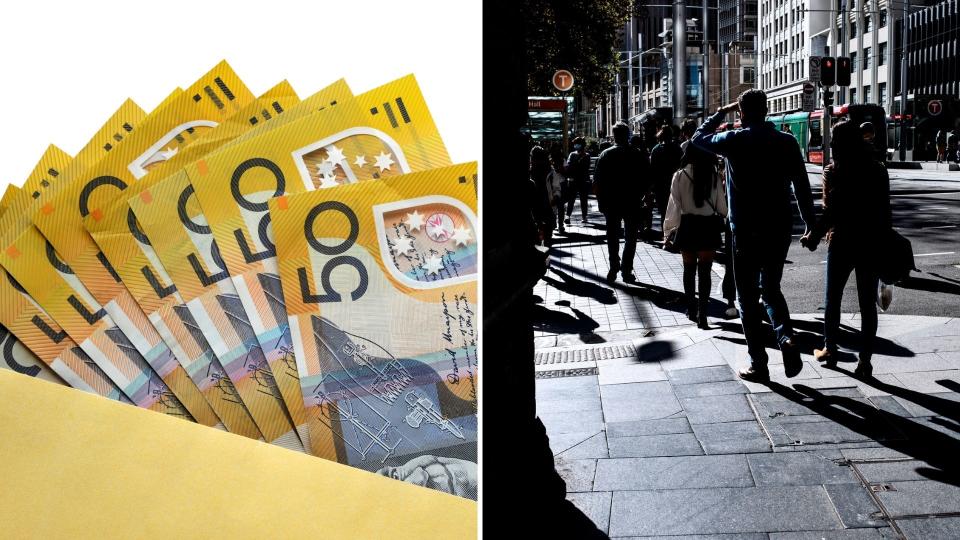 Yellow envelope with Australian $50 notes, pedestrians walking in Sydney. 