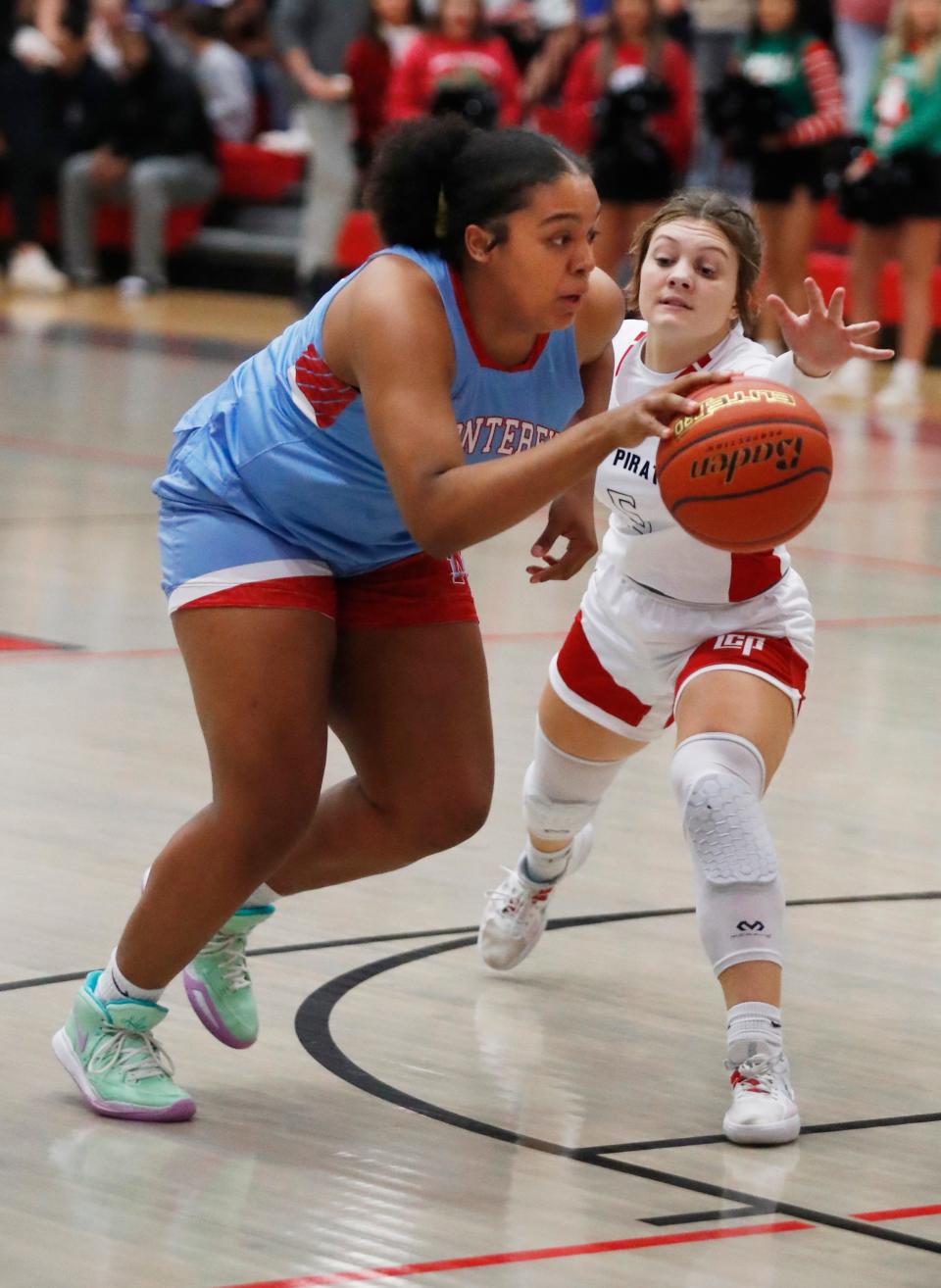 Monterey’s Kelly Mora (30) drives toward the basket against Lubbock-Cooper’s Peyton North (5) in a District 4-5A game Friday, Dec. 16, 2022 at Lubbock-Cooper High School in Woodrow, Texas.
