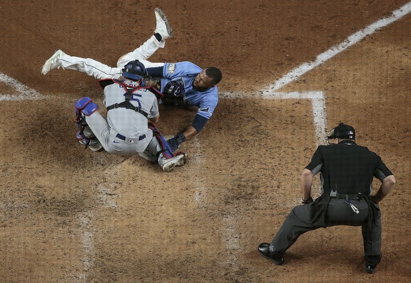 Arlington, Texas, Sunday, October 25, 2020 Tampa Bay Rays right fielder Manuel Margot (13) is tagged out.