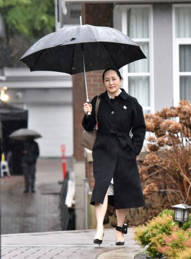 Huawei chief financial officer Meng Wanzhou leaves her Vancouver home to go to her extradition hearing on January 23, 2020; the case was adjourned