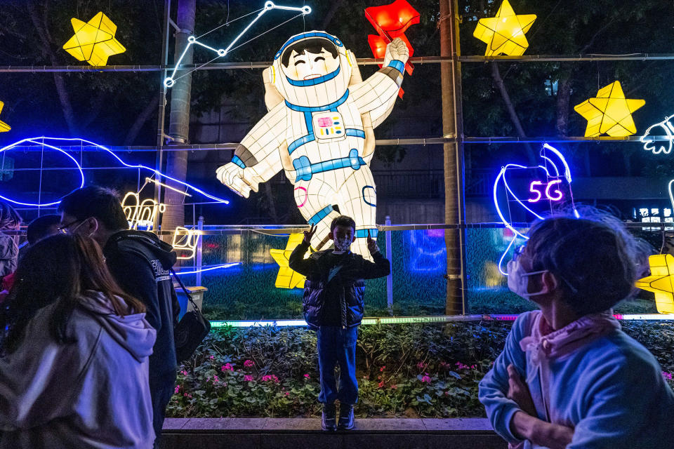 A child poses for a photo in Guangzhou Cultural Park in China during the Lantern Festival on Feb. 5, 2023. 