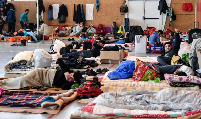 France received a record 100,000 asylum applications last year