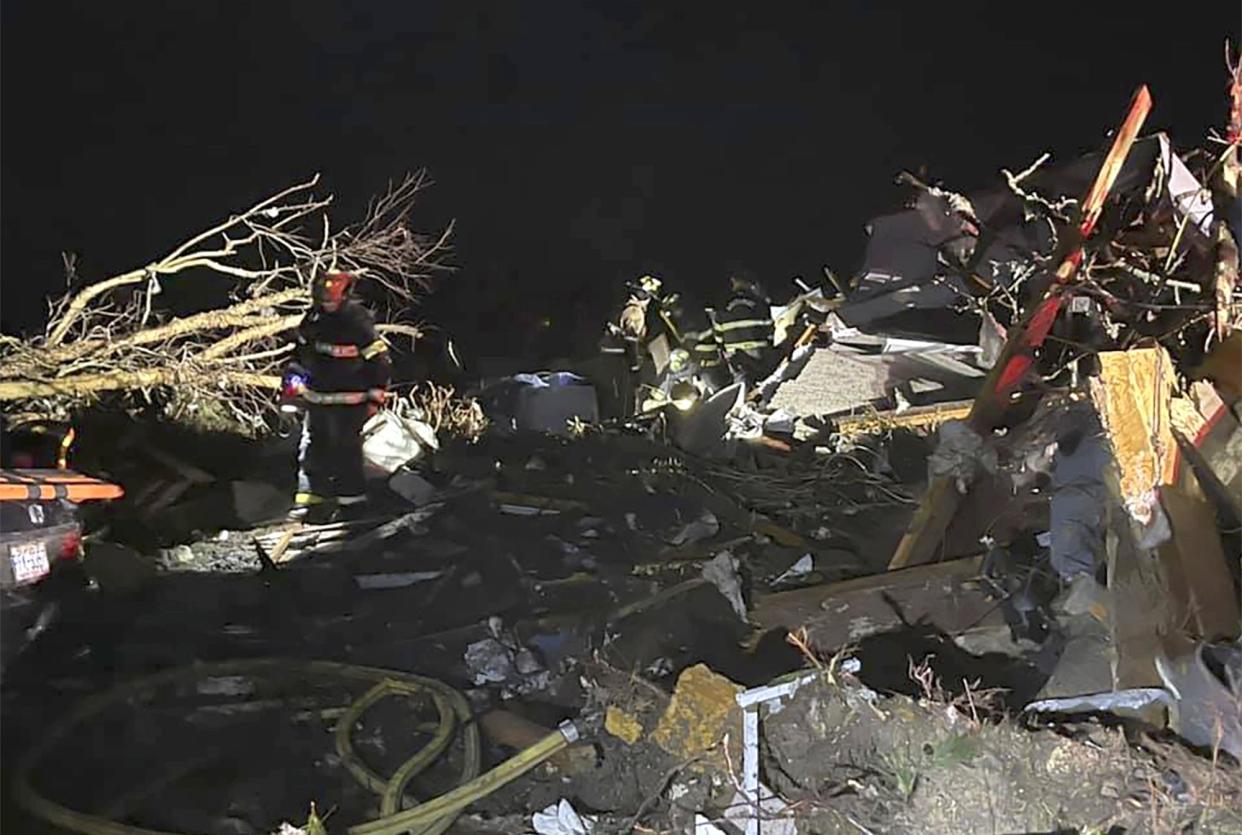 Firefighters respond to the site of a deadly tornado that tore through Brunswick County, N.C. early Tuesday, Feb. 16, 2021. North Carolina authorities say multiple people are dead and others were injured after a tornado ripped through Brunswick County, leaving a trail of heavy destruction.