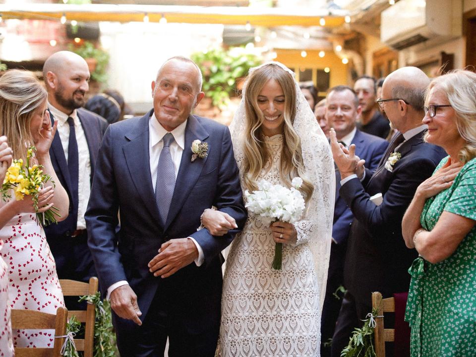 My dad walking me down the aisle, both of us so happy but definitely trying not to cry or faint.