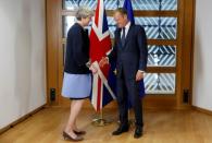 British Prime Minister Theresa May and European Council President Donald Tusk pose during a EU leaders summit in Brussels, Belgium, June 22, 2017. REUTERS/Francois Lenoir