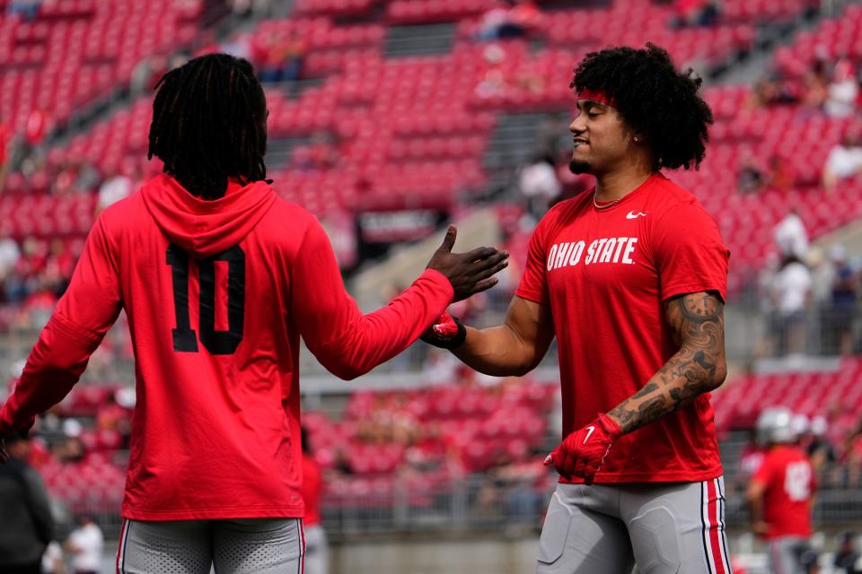 Sep 16, 2023; Columbus, Ohio, USA; Ohio State Buckeyes safety Lathan Ransom (8) warms up with cornerback Denzel Burke (10) prior to the NCAA football game against the Western Kentucky Hilltoppers at Ohio Stadium.