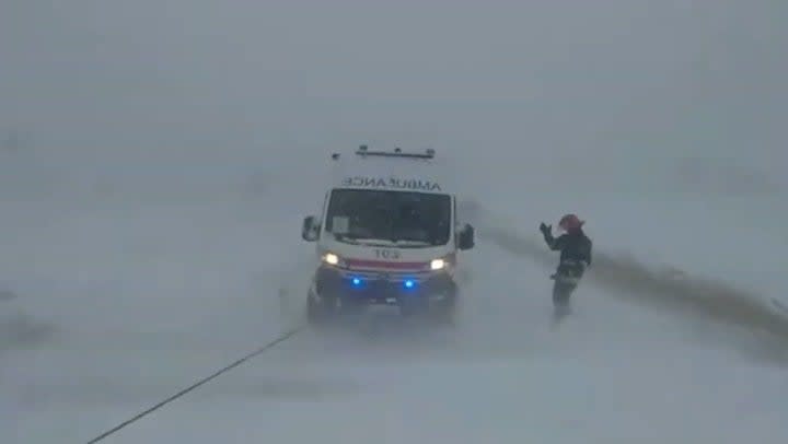 Ukrainian emergency workers tow ambulance from snow as storm kills five (The State Emergency Service of Ukraine)