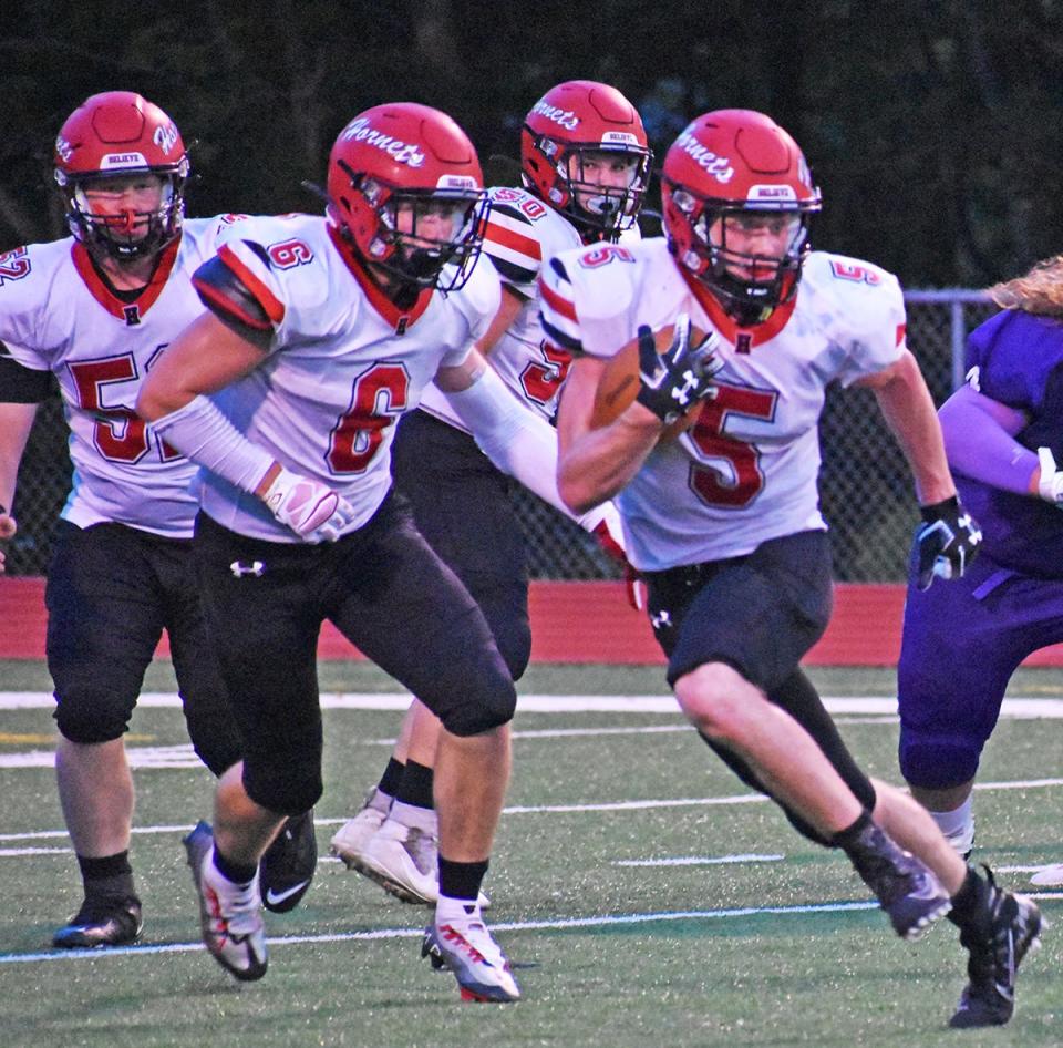 Honesdale's Max Mickel (5) looks for room to run during a Week 1 Lackawanna Football Conference battle with archrival Wallenpaupack Area.