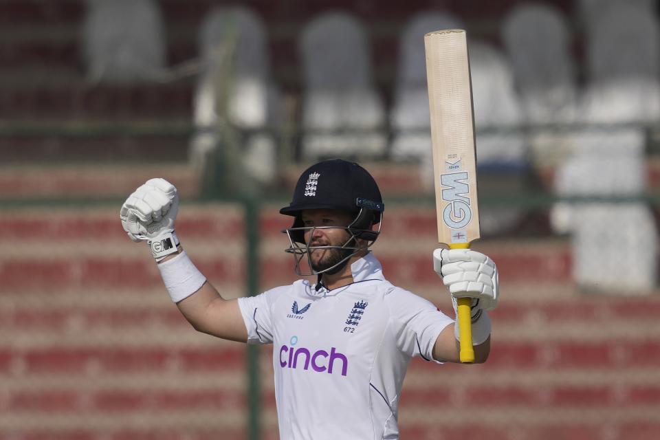 England's Ben Duckett celebrates after winning the third test cricket match against Pakistan, in Karachi, Pakistan, Tuesday, Dec. 20, 2022. (AP Photo/Fareed Khan)