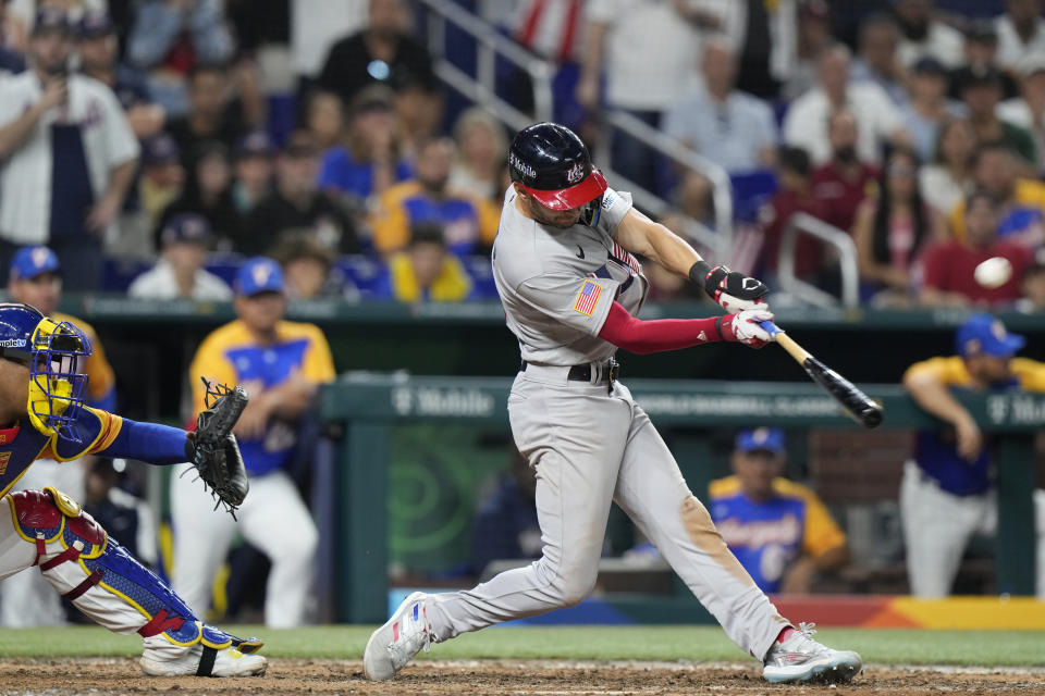 United States' Trea Turner hits a go-ahead grand slam during the eighth inning of a World Baseball Classic game against Venezuela, Saturday, March 18, 2023, in Miami. Tim Anderson, J.T. Realmuto and Bobby Witt Jr. scored on the play. (AP Photo/Wilfredo Lee)