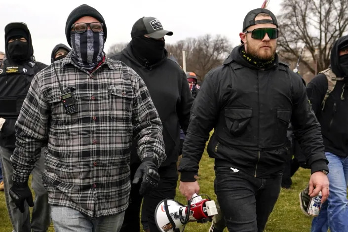 A group of men marching to the U.S. Capitol