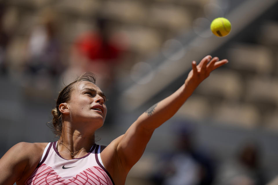 Aryna Sabalenka of Belarus serves against Russia's Kamilla Rakhimova during their third round match of the French Open tennis tournament at the Roland Garros stadium in Paris, Friday, June 2, 2023. (AP Photo/Thibault Camus)