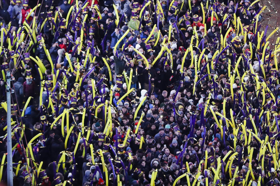 FILE - In this Dec. 31, 2019, file photo, revelers wait for midnight during the New Year's Eve celebration in New York's Times Square, as seen from above from the New York Marriott Marquis hotel. If ever a year's end seemed like cause for celebration, 2020 might be it. Yet the coronavirus scourge that dominated the year is also looming over New Year's festivities and forcing officials worldwide to tone them down. (AP Photo/Frank Franklin II, File)