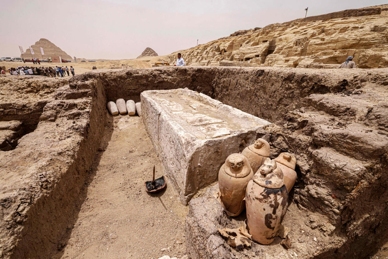 Ancient artifacts rest in a trench at the Saqqara necropolis in Egypt (Khaled Desouki / AFP via Getty Images)