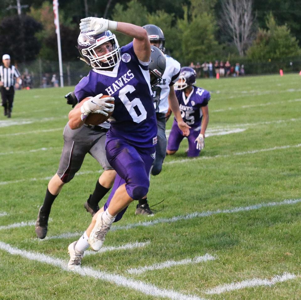 Marshwood's Ty Cougler tries to stay in bounds during last Friday's Class B South game against Noble. The Hawks won 49-26.