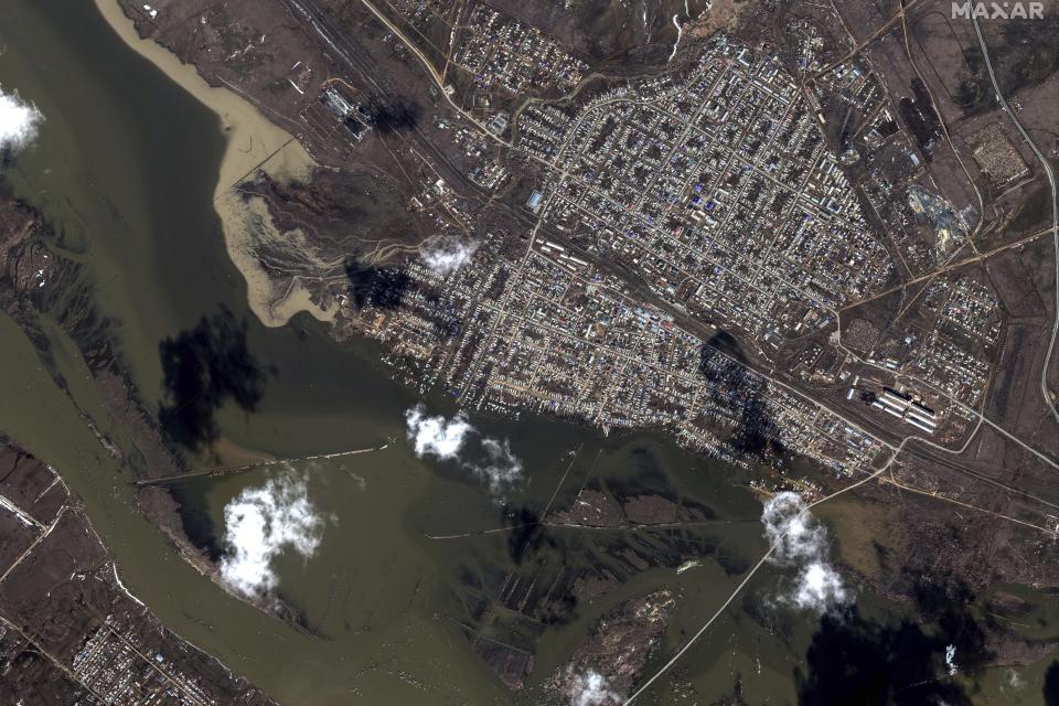 This image provided by Maxar Technologies, shows flooded areas in Akbulak, Russia, Wednesday, April 3, 2024. State media say Russia's government has declared the situation in flood-hit areas in the Orenburg region a federal emergency. (Satellite image ©2024 Maxar Technologies via AP)