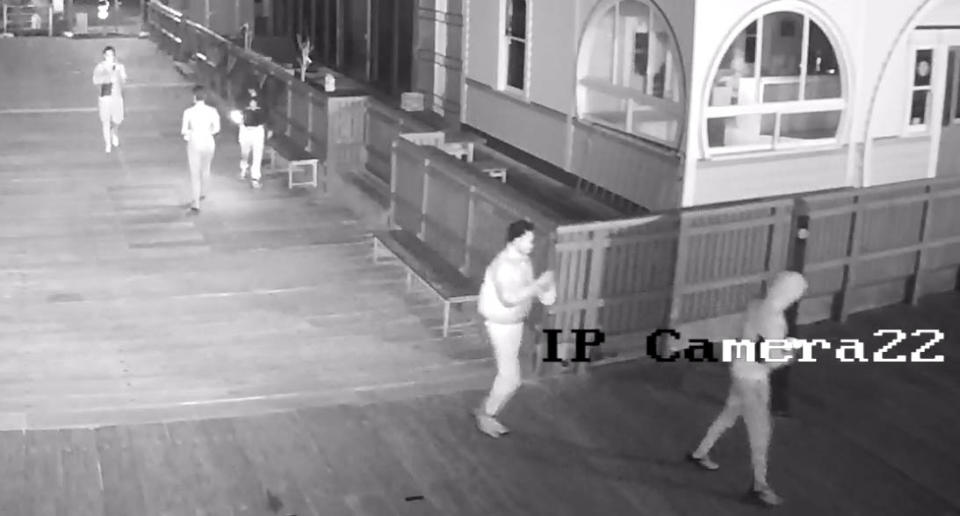 A group of five men believed to be in their 20s caught on CCTV with the penguin on Jacka Boulevard, in front of the Royal Melbourne Yacht Squadron. Source: Crime Stoppers