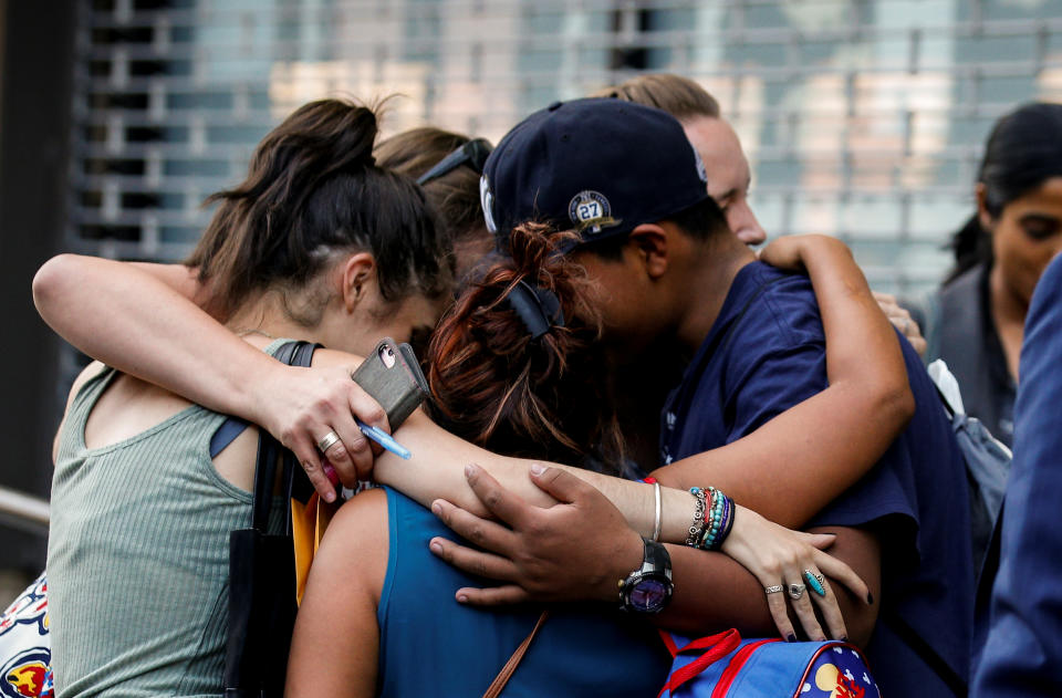 Rosayra Pablo-Cruz, a Guatemalan mother who had been separated from her two sons, is greeted after being reunited with them in New York City on July 13. (Photo: Brendan McDermid/Reuters)