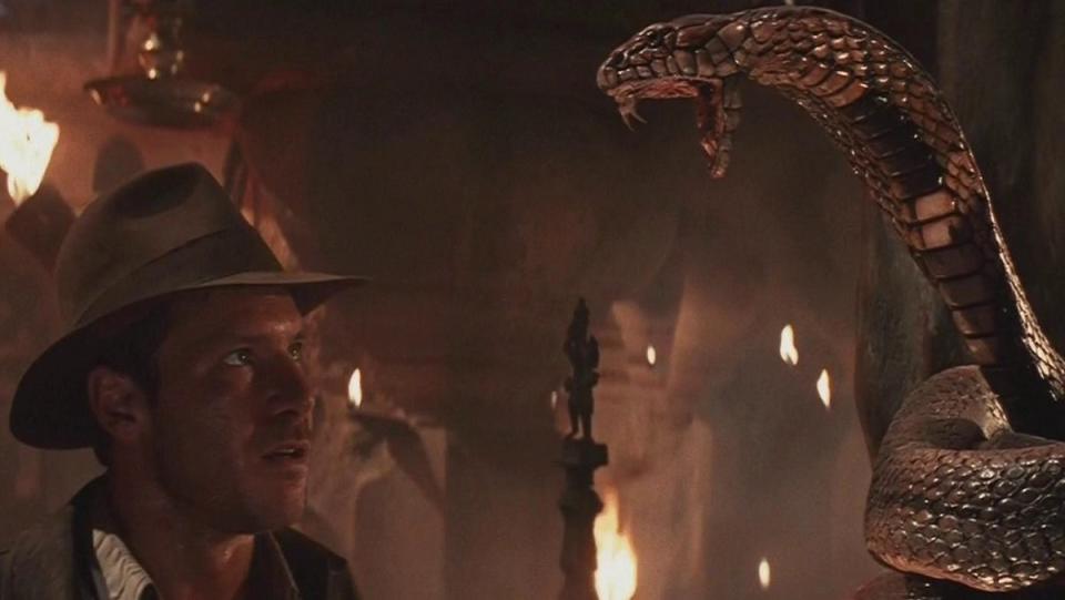 Indiana Jones (Harrison Ford) encounters a snake statue in Temple of Doom.