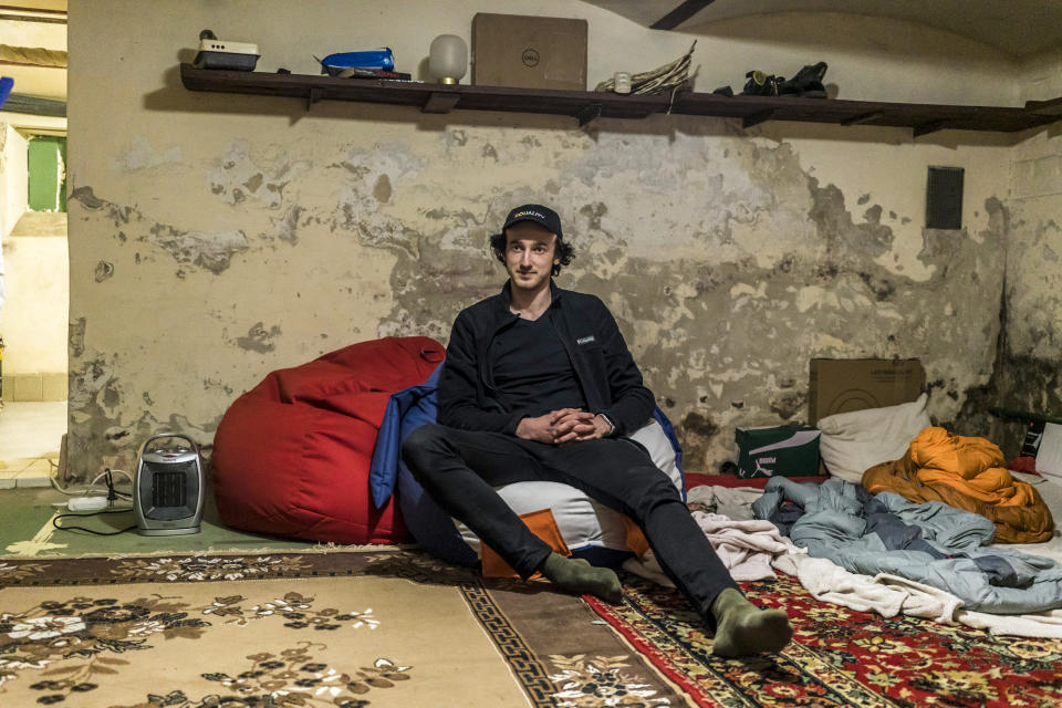 Dmytro Zhluktenko, who quit his job to coordinate the sourcing and delivery of supplies for the Ukrainian military, sits for a portrait in the bomb shelter in his basement on April 13, 2022, in Lviv. (Brendan Hoffman for NBC News)