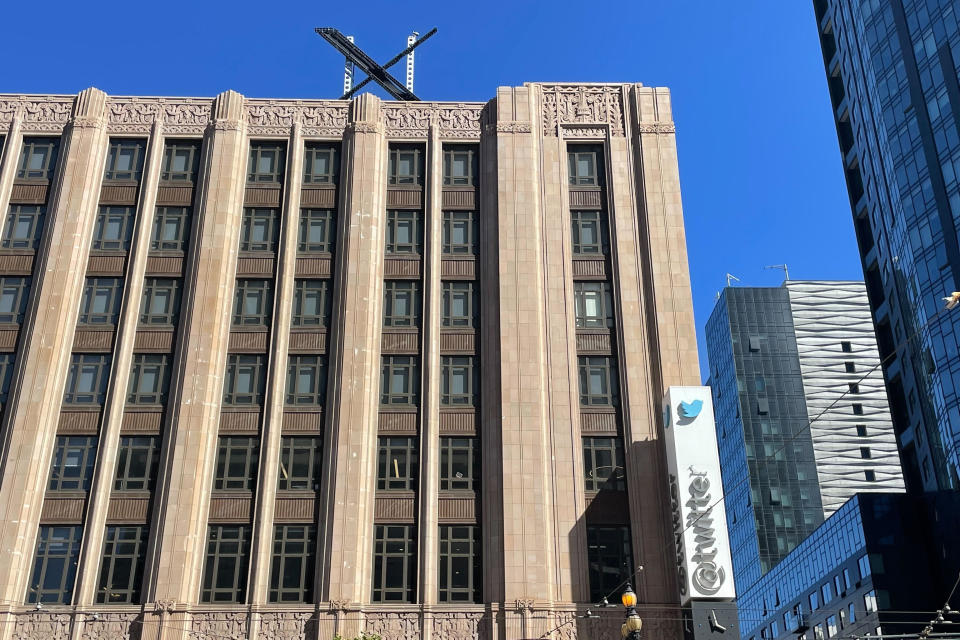 A large, metal "X" sign is seen on top of the downtown building that housed what was once Twitter, now rebranded by its owner, Elon Musk, in San Francisco, Friday, July 28, 2023. The new metal X marker appeared after police stopped workers on Monday, July 24, from removing the iconic bird and logo, saying they didn't have the proper permits and didn't tape off the sidewalk to keep pedestrians safe if anything fell. (AP Photo/Haven Daley)