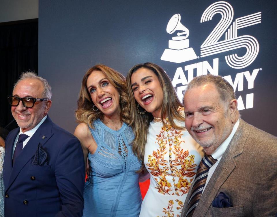 Music mogul Emilio Estefan, left, Lili Estefan, and tv hosts Clarissa Molina, and Raúl De Molina, right, gather for a photo after Manuel Abud, CEO of the Latin Recording Academy, announced the Latin Grammy coming to Miami in November, 2024 during a press conference at the Kaseya Center in Miami, Florida on Wednesday, April 17, 2024.