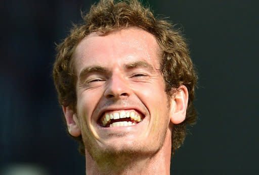 Andy Murray celebrates after winning the Olympic men's singles final against Roger Federer. Murray demolished Federer 6-2, 6-1, 6-4 to win his first gold medal and avenge his Wimbledon final defeat against the world number one