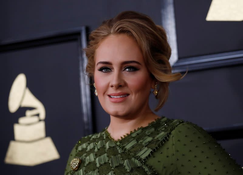 FILE PHOTO: Singer Adele arrives at the 59th Annual Grammy Awards in Los Angeles