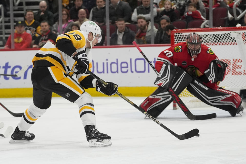 Pittsburgh Penguins right wing Reilly Smith scores on Chicago Blackhawks goaltender Arvid Soderblom during the first period of an NHL hockey game Thursday, Feb. 15, 2024, in Chicago. (AP Photo/Erin Hooley)