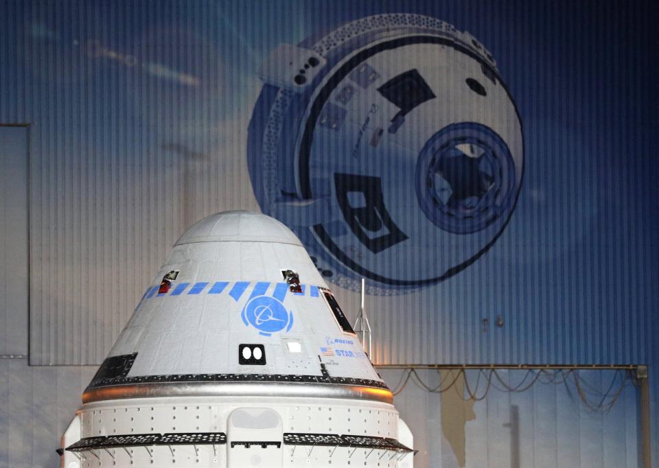 A close-up view of the CST-100 Starliner spacecraft while rolling out from Boeings Commercial Cargo and Processing Facility in the pre-dawn hours at the Kennedy Space Center in Cape Canaveral, Florida on July 17, 2021, ahead of its scheduled launch on July 30. (Photo by Gregg Newton / AFP) (Photo by GREGG NEWTON/AFP via Getty Images)