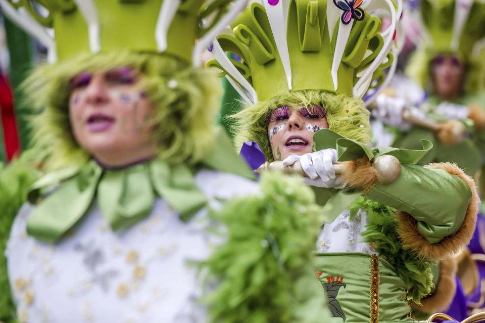 FILE - In this Sunday, Feb. 10, 2013 file photo, people celebrate carnival during the yearly procession in Aalst, Belgium. The famed Belgian carnival town of Aalst on Sunday, Dec. 1, 2019 is renouncing its place on the U.N.'s cultural agency heritage list saying it was sick of the widespread complaints that this spring's edition contained blatant anti-Semitism and insisted no one should try to muzzle humor of any kind. (AP Photo/Geert Vanden Wijngaert, File)