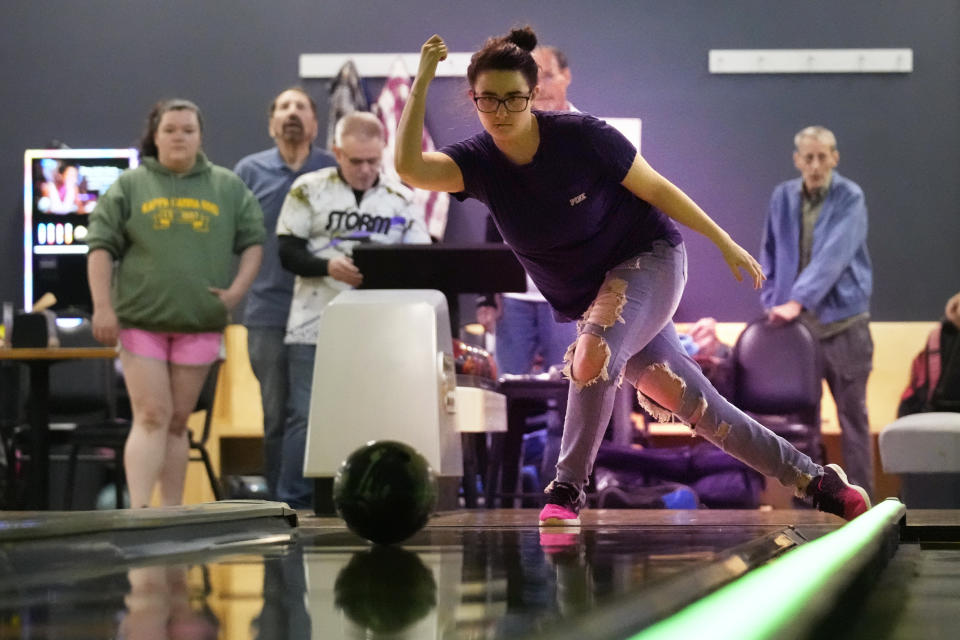 Katie Nichols bowls at Just In Time Recreation during the reopening of the bowling alley six months after a deadly mass shooting, Friday, May 3, 2024, in Lewiston, Maine. (AP Photo/Robert F. Bukaty)