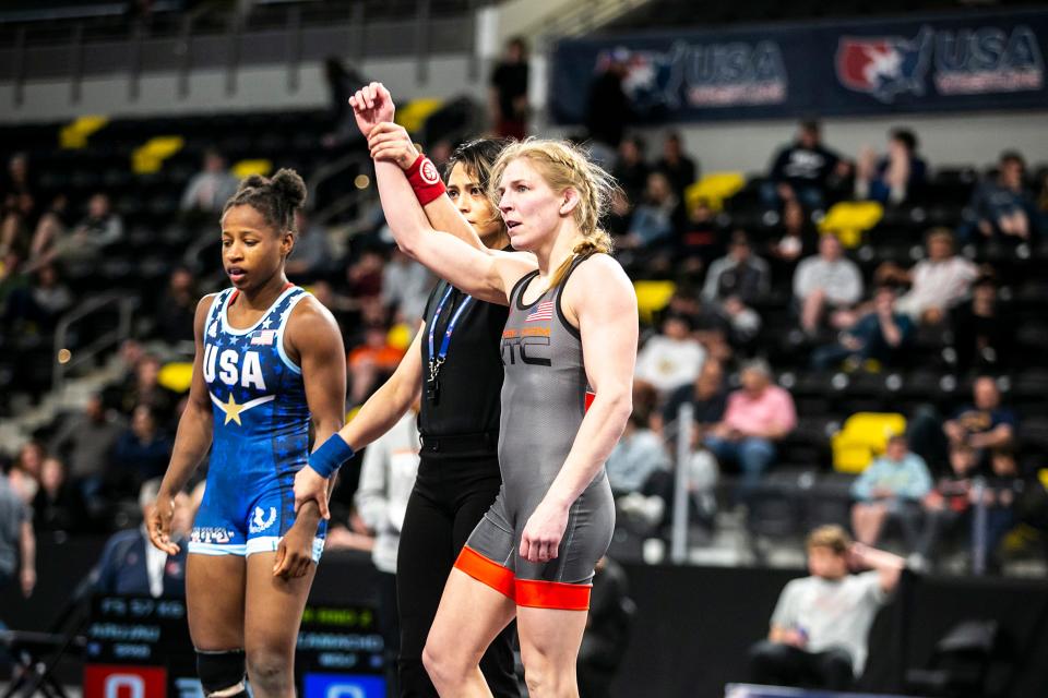 Alyssa Lampe, right, has her hand raised after scoring a fall against Erin Golston at 50 kg during the final session of the USA Wrestling World Team Trials Challenge Tournament on May 22 at Xtream Arena in Coralville.