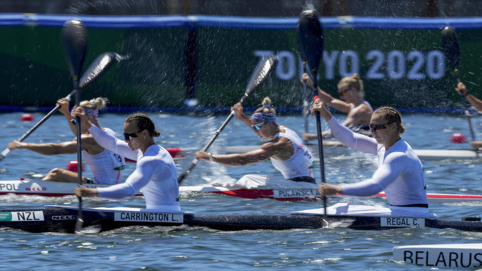 Lisa Carrington and Caitlin Regal of New Zealand and Volha Khudzenka, bottom, and Maryna Litvinchuk of Belarus compete in the women's kayak double 500m semifinal at the 2020 Summer Olympics, Tuesday, Aug. 3, 2021, in Tokyo, Japan. (AP Photo/Darron Cummings)