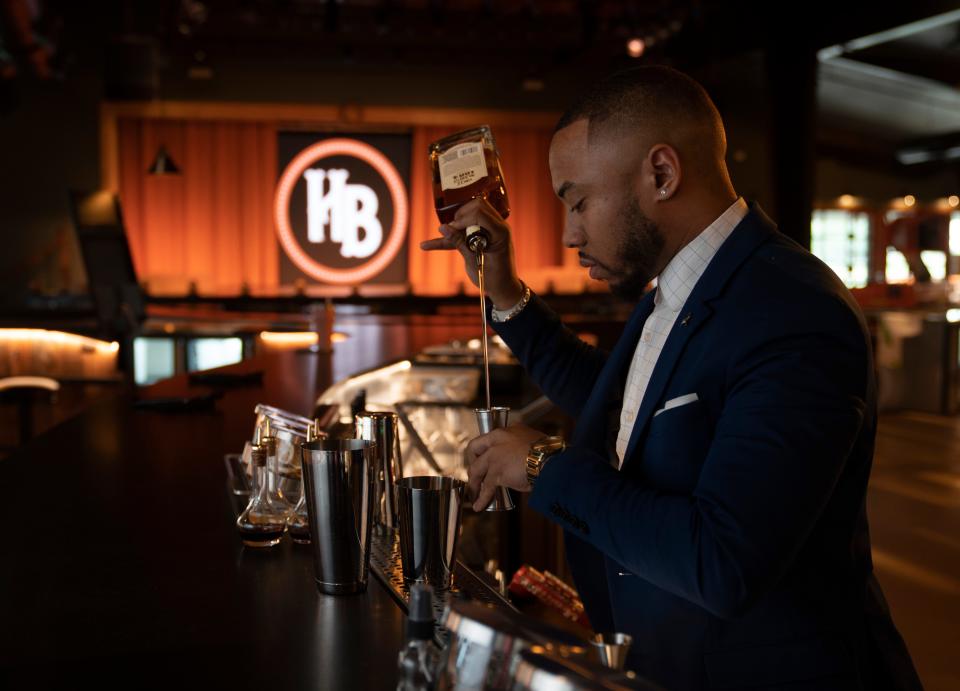 Humble Baron beverage director DeAndre Jackson prepares a cocktail at the new Humble Baron bar restaurant at Nearest Green Distillery Monday, March 13, 2023, in Shelbyville, Tenn.