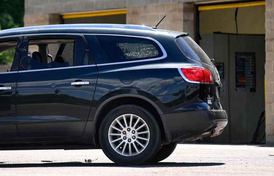 A car remains at the scene of an officer-involved shooting on Monday, July 11, 2022, at the H2Ose It car wash on Cleveland Avenue in Sioux Falls.