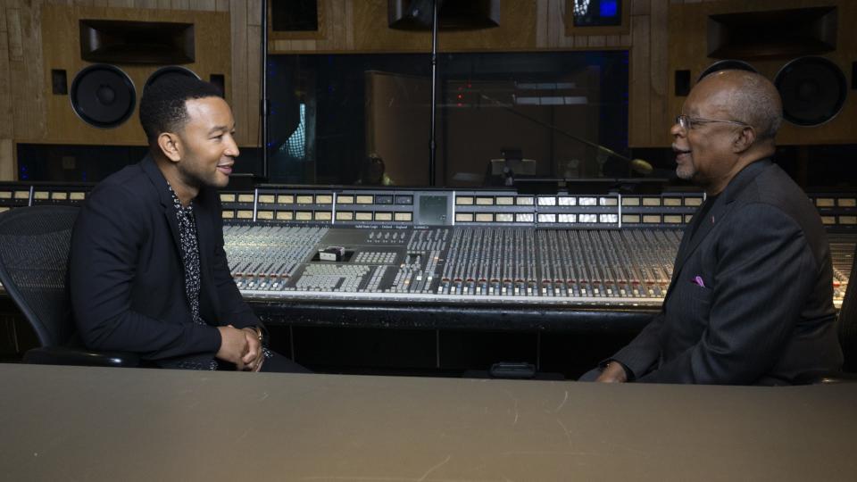 Henry Louis Gates Jr. talks to music star John Legend, a fellow executive producer on Gates' PBS documentary, "The Black Church: This Is Our Story, This Is Our Song."