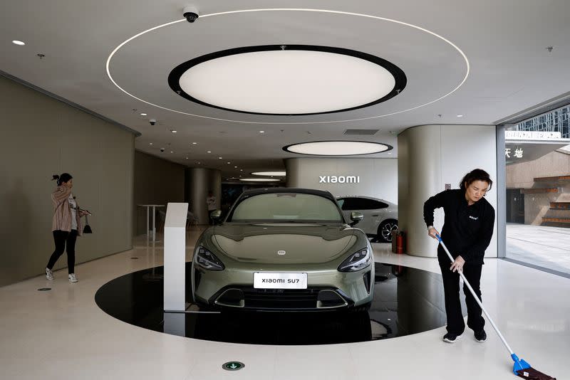 Xiaomi's first electric vehicle SU7 is displayed at a showroom of a newly opened Xiaomi store in Beijing