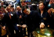 Alibaba Group Holding Ltd founder Jack Ma (C) rings a ceremonial bell to start trading during his company's initial public offering (IPO) under the ticker "BABA" at the New York Stock Exchange in New York September 19, 2014. REUTERS/Brendan McDermid