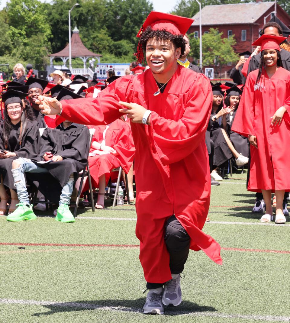 Brockton High School's Jonathan Douesius receives his diploma during the 156th graduation exercises on Saturday, June 4, 2022.