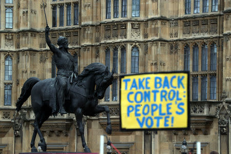 An Anti-Brexit sign is seen next to a statue of King Richard I outside the Houses of Parliament, in Westminster, London, Britain March 4, 2019. REUTERS/Hannah McKay