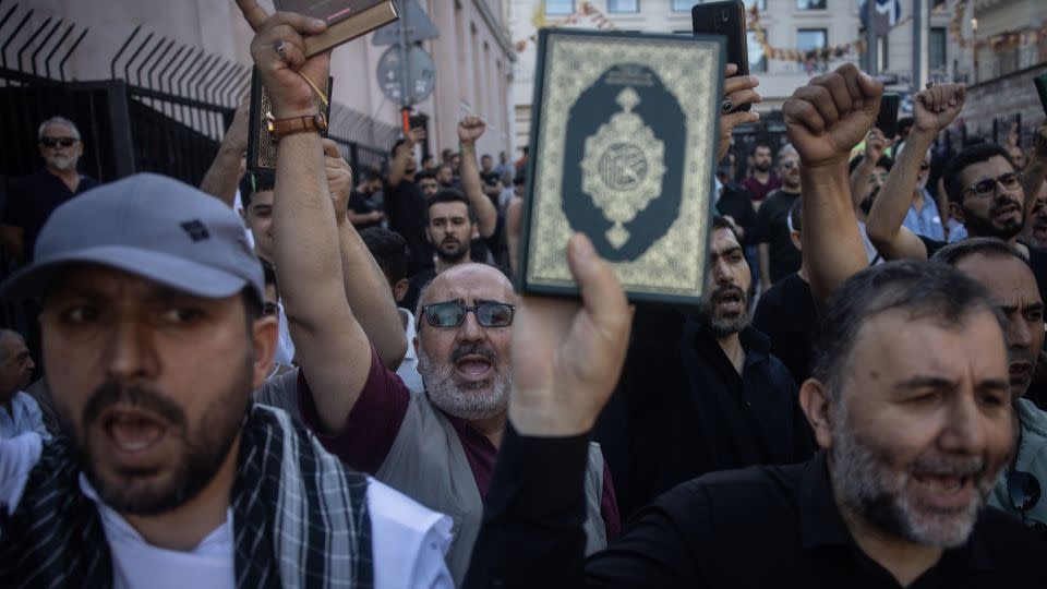 Protesters held copies of the Quran outside the Swedish Consultate in Istanbul, Turkey, on July 30, 2023. - Chris McGrath/Getty Images