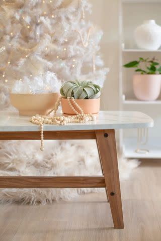 <p><a href="https://lovelyindeed.com/diy-wood-bead-garland/" data-component="link" data-source="inlineLink" data-type="externalLink" data-ordinal="1">Lovely Indeed</a></p>