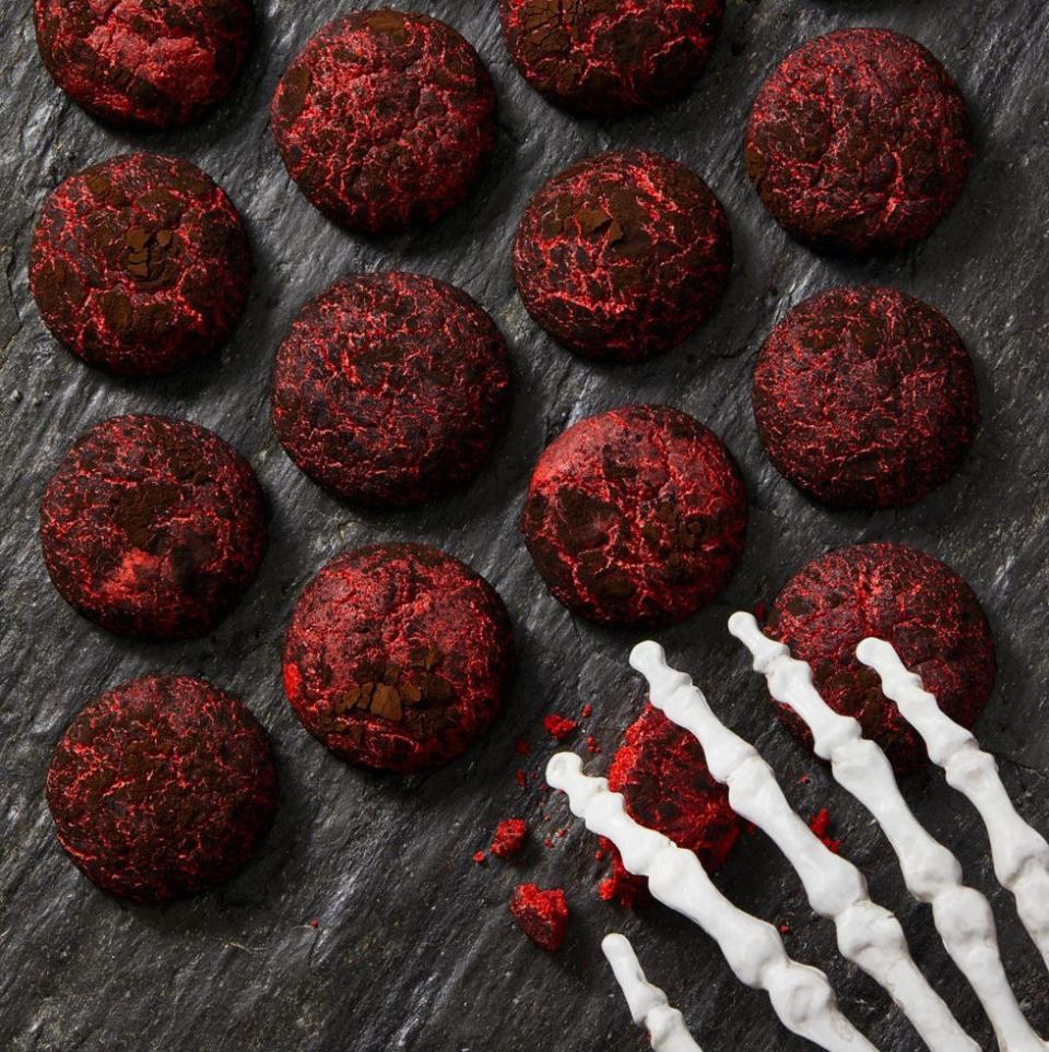 <p>We rolled chewy red velvet cookie dough in dark black cocoa powder (we love <a href="https://shop.kingarthurbaking.com/items/black-cocoa-12-oz" rel="nofollow noopener" target="_blank" data-ylk="slk:King Arthur brand;elm:context_link;itc:0;sec:content-canvas" class="link ">King Arthur brand</a>) for an extra-spooky effect.</p><p><em><a href="https://www.goodhousekeeping.com/food-recipes/a28509374/black-and-red-crinkle-cookies-recipe/" rel="nofollow noopener" target="_blank" data-ylk="slk:Get the recipe for Black and Red Crinkle Cookies »;elm:context_link;itc:0;sec:content-canvas" class="link ">Get the recipe for Black and Red Crinkle Cookies »</a></em></p>